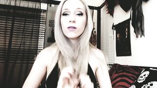 cute golden-haired camgirl brushes her lengthy silvery hair