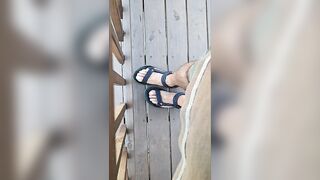 My hunk pedicured feet in sandals