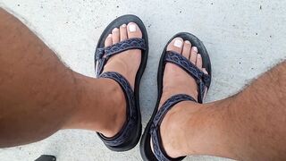 My hunk pedicured feet in sandals