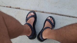My hunk pedicured feet in sandals