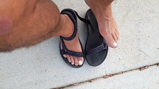 My hunk pedicured feet in sandals