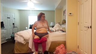 big beautiful woman nurse Vicki undresses and puts on a suit quick change