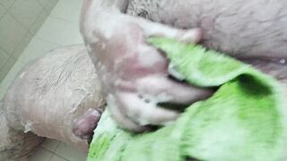 See a bulky stud clean his thick wang and large balls