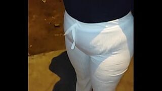 LARGE-BOOTY OLDER WITH RED THREAD ON THE STREET