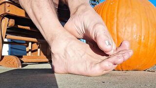Showing off my pedicured feet next to my pumpkin