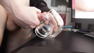 Wanking a load into a glass mug