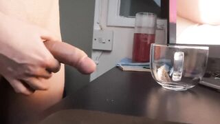 Wanking a load into a glass mug