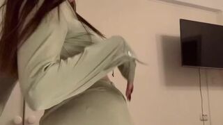 pretty brunette hair in a green hot dress.