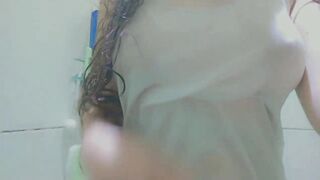 beauty wearing a white tshirt and masturbation at shower