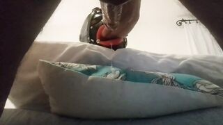 My wife is hogtied on the daybed with an open gag on her throat. I banged her mouth and cummed on her