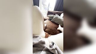 fingering my moist cunt on the daybed awaiting to get caught