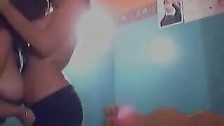 Two sexy lesbians touch and suck tits