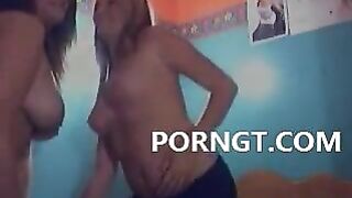 Two sexy lesbians touch and suck tits