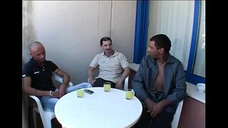 2 Youthful Harlots Surrounded by a Group of Older Males