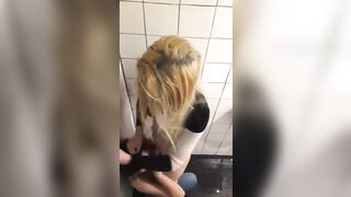 Two lesbians in night club bathroom