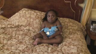 Black midget gets sprayed on her abdomen