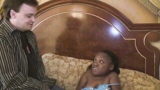 Black midget gets sprayed on her abdomen