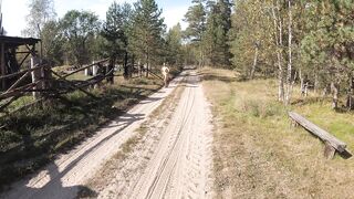 Undressed gal walking in the village