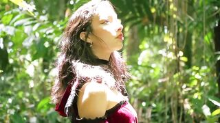 Little Red Riding Hood walking alone in the forest