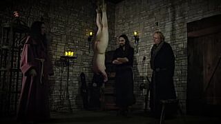 Mooin Witch – The exhausted milkmaid is pulled upside down to the ceiling with weights at her wrists to be tormented and interrogated further and to watch milk flowing (preview)