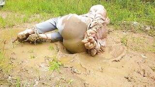 Fastened up and left in the mud! Juicy and bawdy shemale angel pees in her panties!