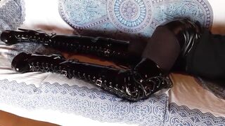 Total ebony with fishnets hose and boots over the knee
