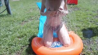 Golden-haired does Slide n Slip Nude in her backyard & masturbates