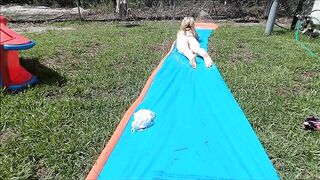 Golden-haired does Slide n Slip Nude in her backyard & masturbates