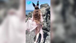 Tiny princess teases on a public beach in advance of sex