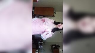 A nice-looking woman bare in nature's garb for a slutty audience.