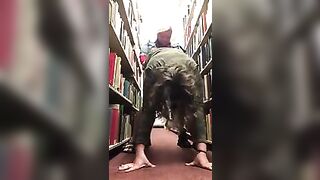 Lesbians fuck in library with strapon