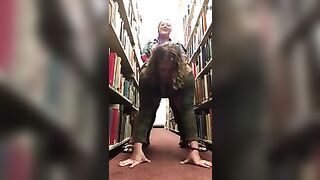 Lesbians fuck in library with strapon