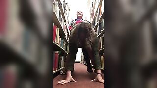 Lesbians fuck in library with strapon