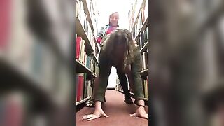Lesbians fuck in library with strapon