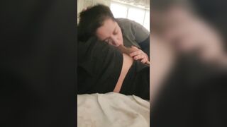 big beautiful woman watches tv and sucks a knob