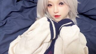 A woman with short silver hair