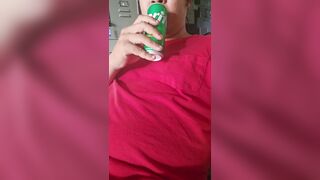 Chap enjoying a sprite, licking and smacking lips