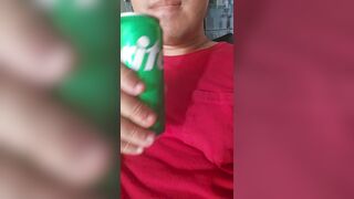 Chap enjoying a sprite, licking and smacking lips