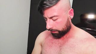 Physiotherapist relaxes his client with manual labor on his large white rod