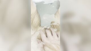 Gal masturbates in bathtub with her fingers and brings herself to climax