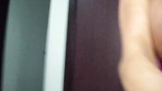 Nikita Von James plays with her large breasts
