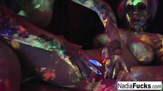 Ebony-light honeys Nadia and Ophelia suck off a colorful dong