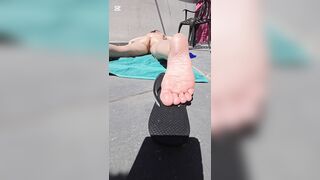 Sunbathing on balcony (feet soles angle solely)