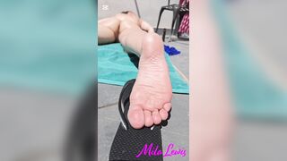 Sunbathing on balcony (feet soles angle solely)