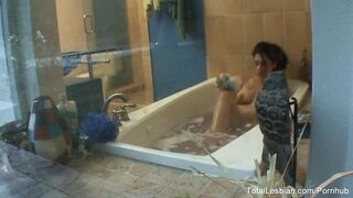 Cute brunette hair watches her stepsister take a baths