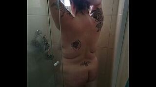 big beautiful woman takes a shower after gym