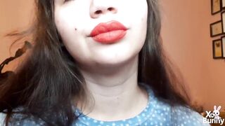 Natural lips with red lipstick smokin' a cigarette in close up