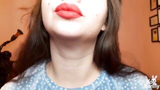 Natural lips with red lipstick smokin' a cigarette in close up