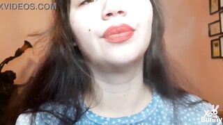 Natural lips with red lipstick smokin' a cigarette in close up