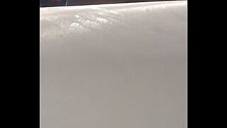 Hawt woman disrobes on a balcony and touches her cunt in a Hawt Spa inside water during the time that being watched.